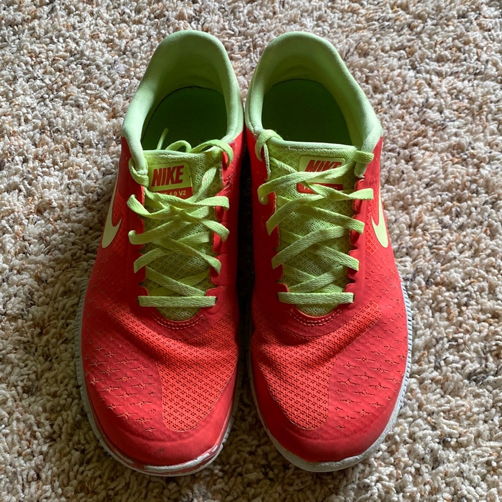 Nike Free Runs 4.0. Bright, orange/red color with lime green. Size 9 womens